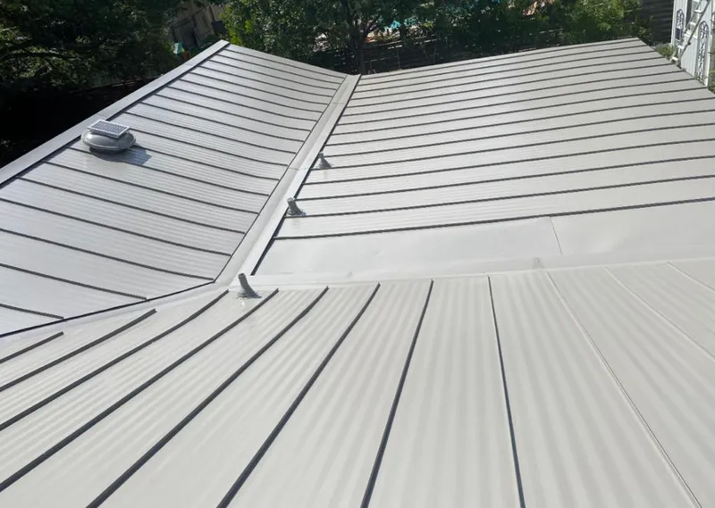 Solar attic fan installed on a metal roof for Roof Ventilation in West Linn